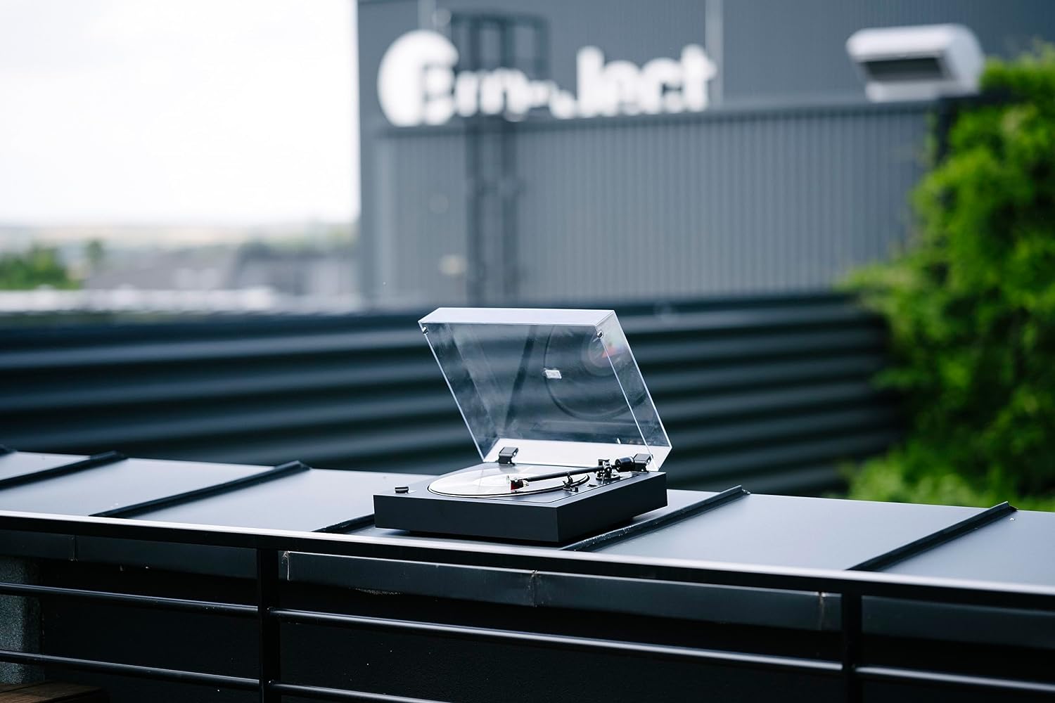 Pro-Ject Automat A2 turntable with 2M Red cartridge, featuring a sleek black base and tonearm for high-quality vinyl playback.