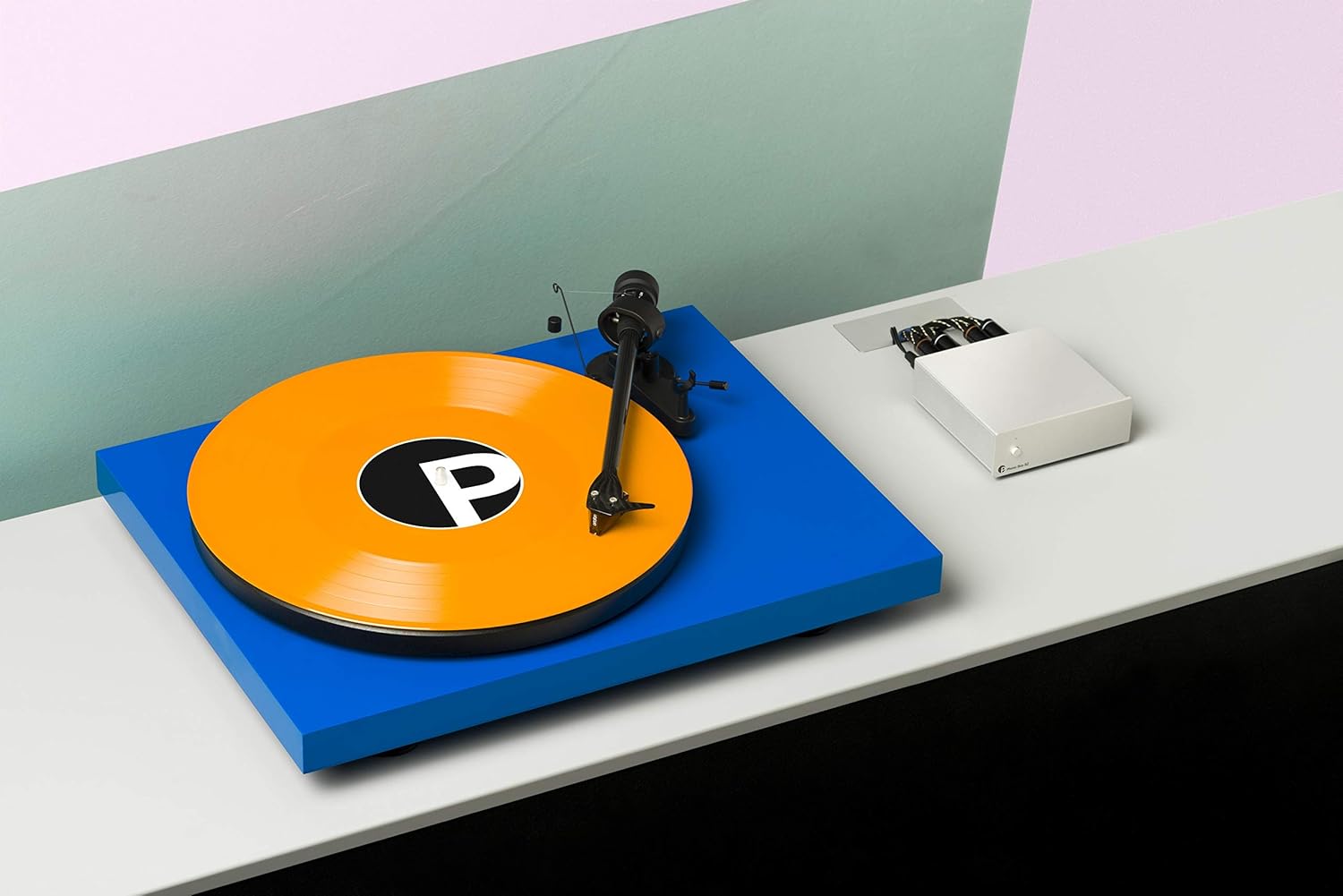 Pro-Ject Phono Box S2 Ultra phono preamp with silver finish, featuring input and output jacks and control knobs for vinyl record listening.