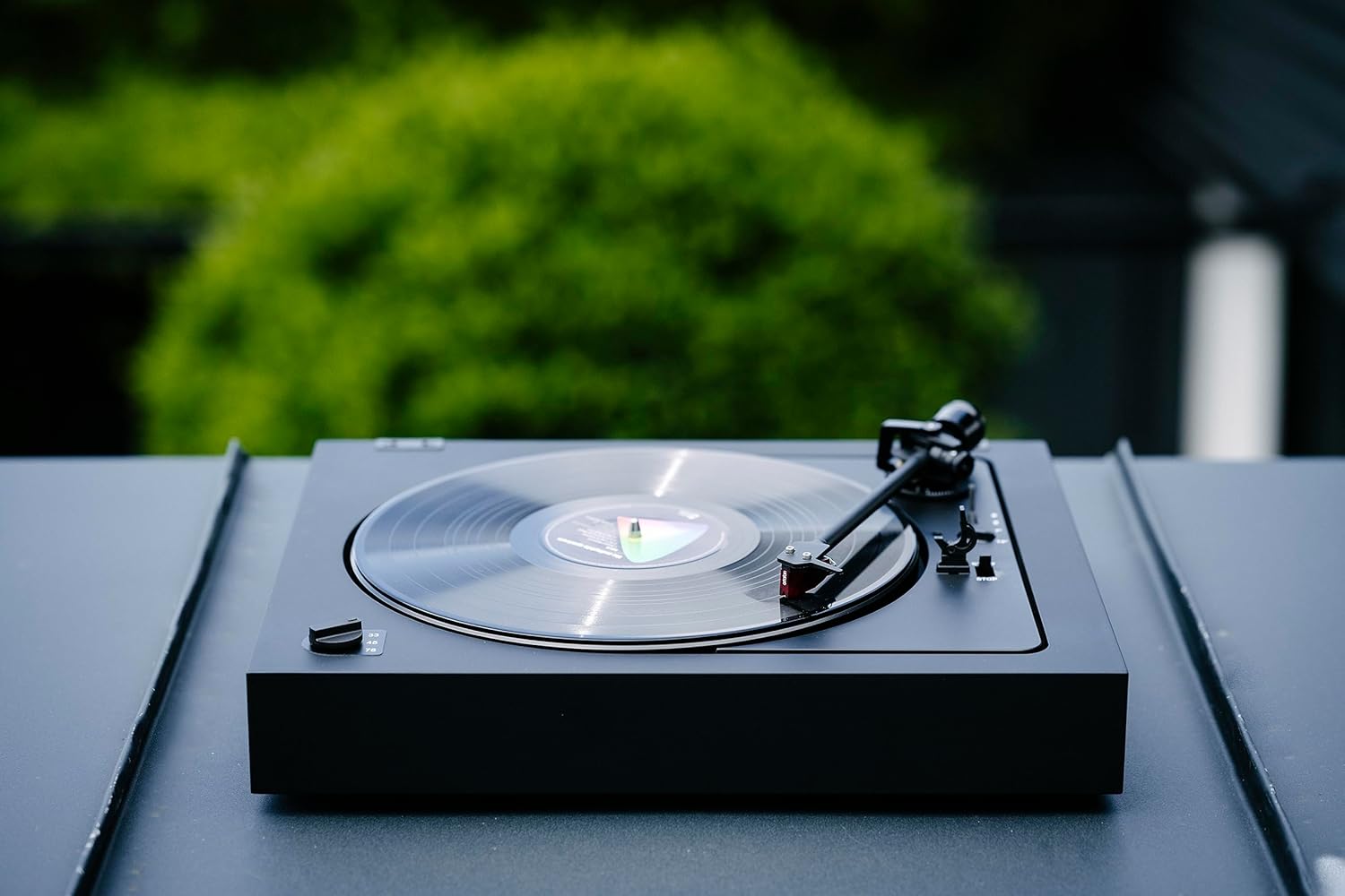 Pro-Ject Automat A2 turntable with 2M Red cartridge, featuring a sleek design and tonearm for high-quality vinyl playback.