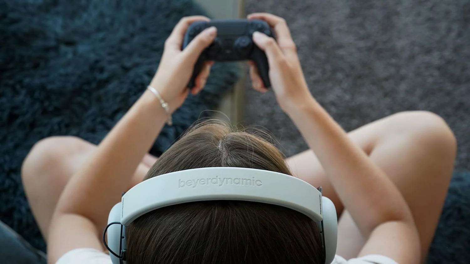 Beyerdynamic MMX 200 Wireless gaming headphones with adjustable headband and over-ear design, featuring built-in microphone.