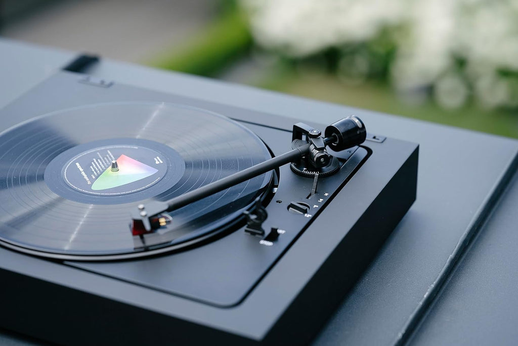 Pro-Ject Automat A2 turntable with 2M Red cartridge, featuring sleek design and tonearm for high-quality vinyl playback.