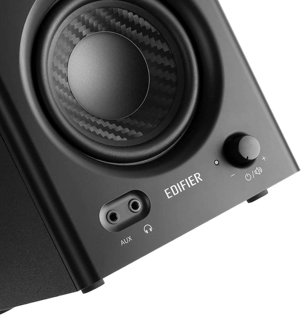 Edifier MR4 desktop speakers with sleek black design and compact size, featuring dual speaker drivers and modern aesthetic.