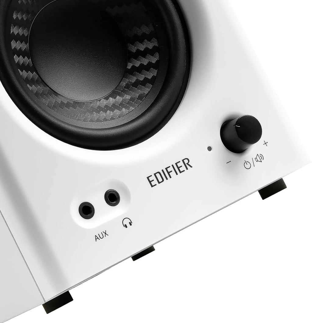 Edifier MR4 desktop speakers with black finish, compact design, and speaker grille visible on a clean desk setup.