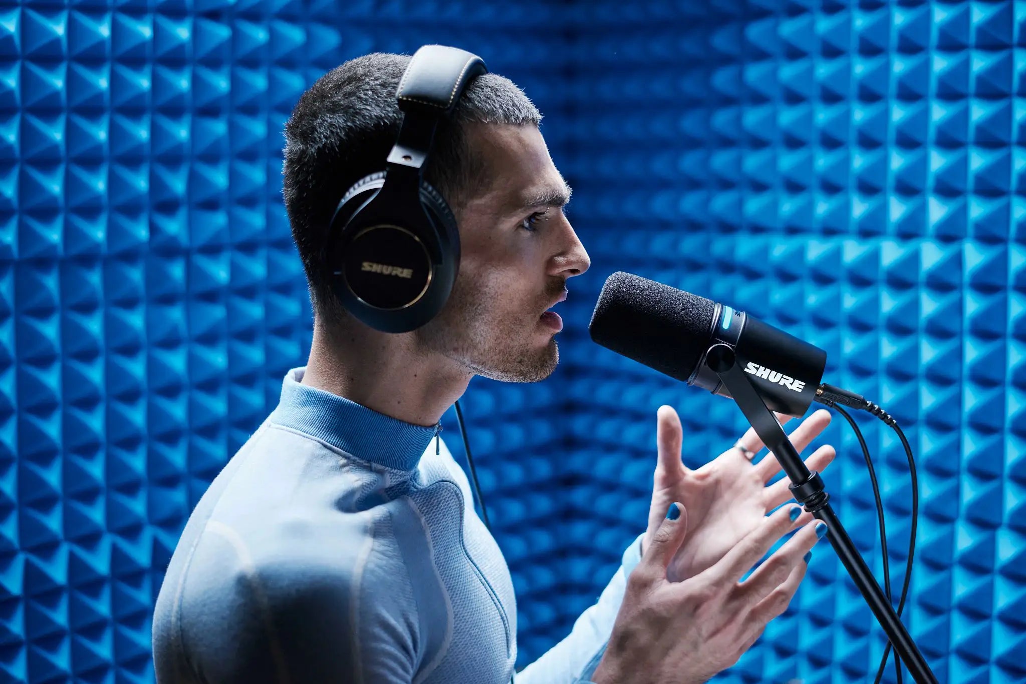 Shure MV7+ USB microphone with adjustable stand and pop filter, ideal for podcasting and streaming.