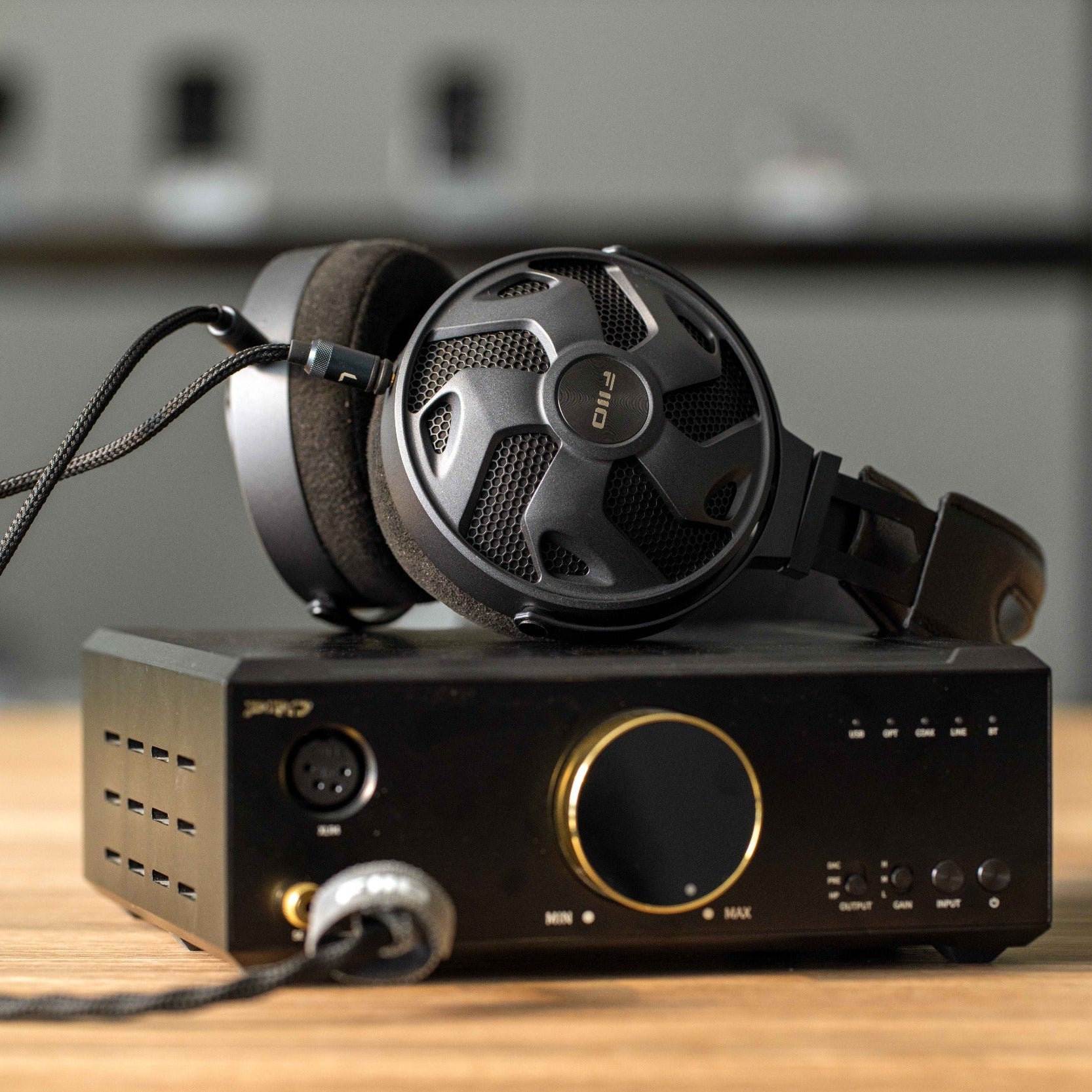 FiiO FT3 wired headphones with 32Ω impedance, featuring sleek black earphones and inline remote for portable audio.