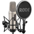 Rode NT2-A condenser microphone in studio pack, featuring professional-grade microphone with shock mount and accessories for recording.