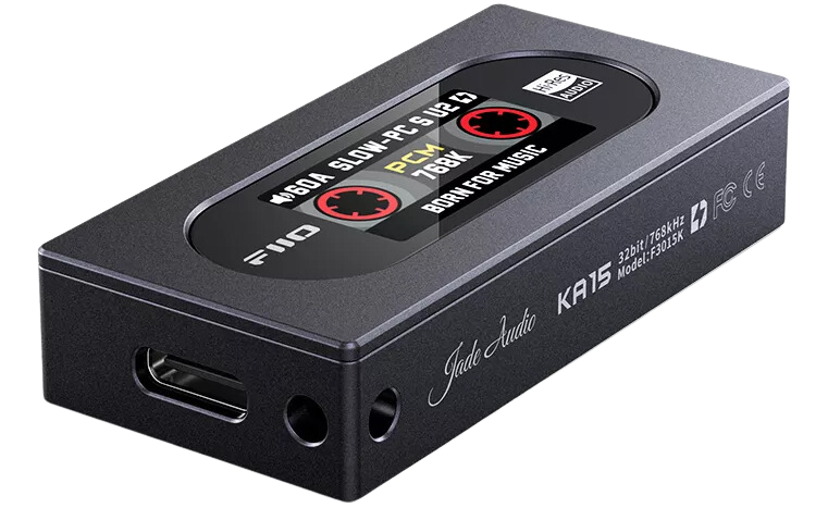 FiiO KA15 headphone amplifier and DAC with sleek black design, multiple input ports, and volume controls on top.