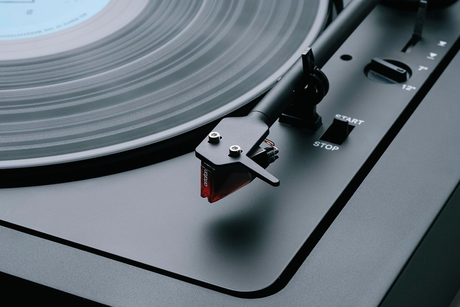 Pro-Ject Automat A2 turntable with 2M Red cartridge, featuring a sleek black base and tonearm for high-quality vinyl playback.