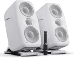 IK Multimedia iLoud MTM MK2 active nearfield monitors sitting on a desk, with their sleek black design and front speaker grilles.