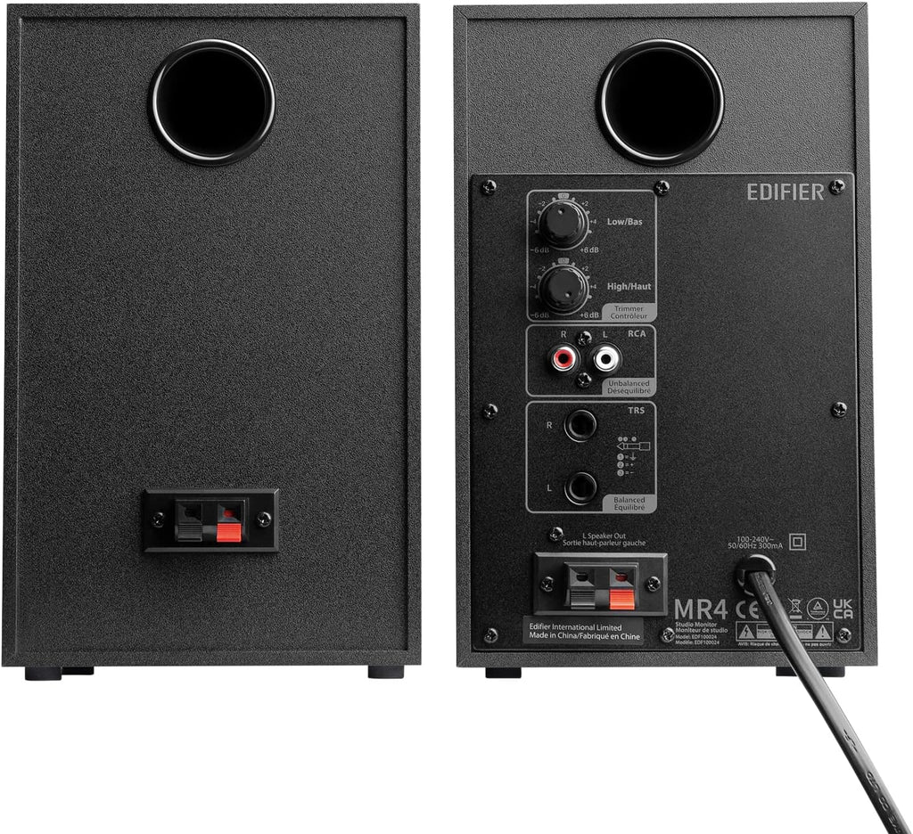 Edifier MR4 desktop speakers with black finish and compact design, featuring dual speaker units on a sleek wooden stand.
