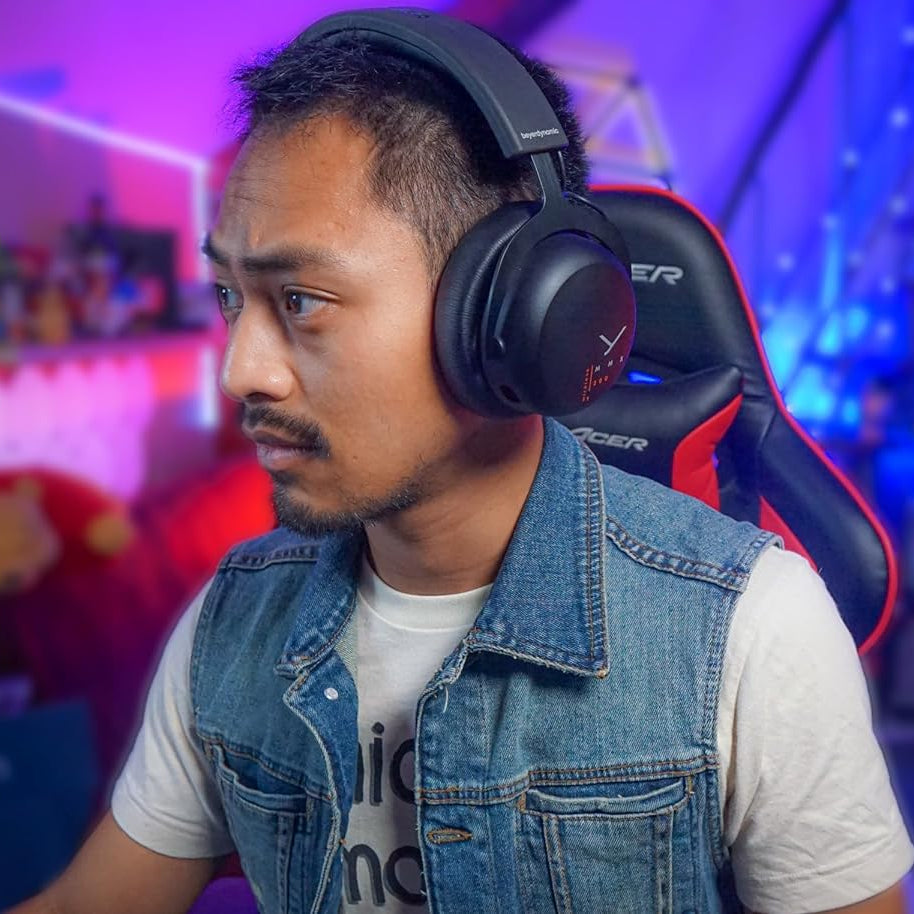 Beyerdynamic MMX 200 Wireless gaming headphones with over-ear design, microphone, and adjustable headband for immersive gaming sound.
