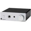 Pro-Ject Head Box E headphone amplifier and DAC with sleek black design and multiple input options for high-quality audio.