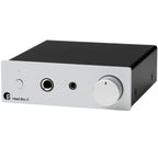 Pro-Ject Head Box E headphone amplifier and DAC with sleek black design and multiple input options for high-quality audio.