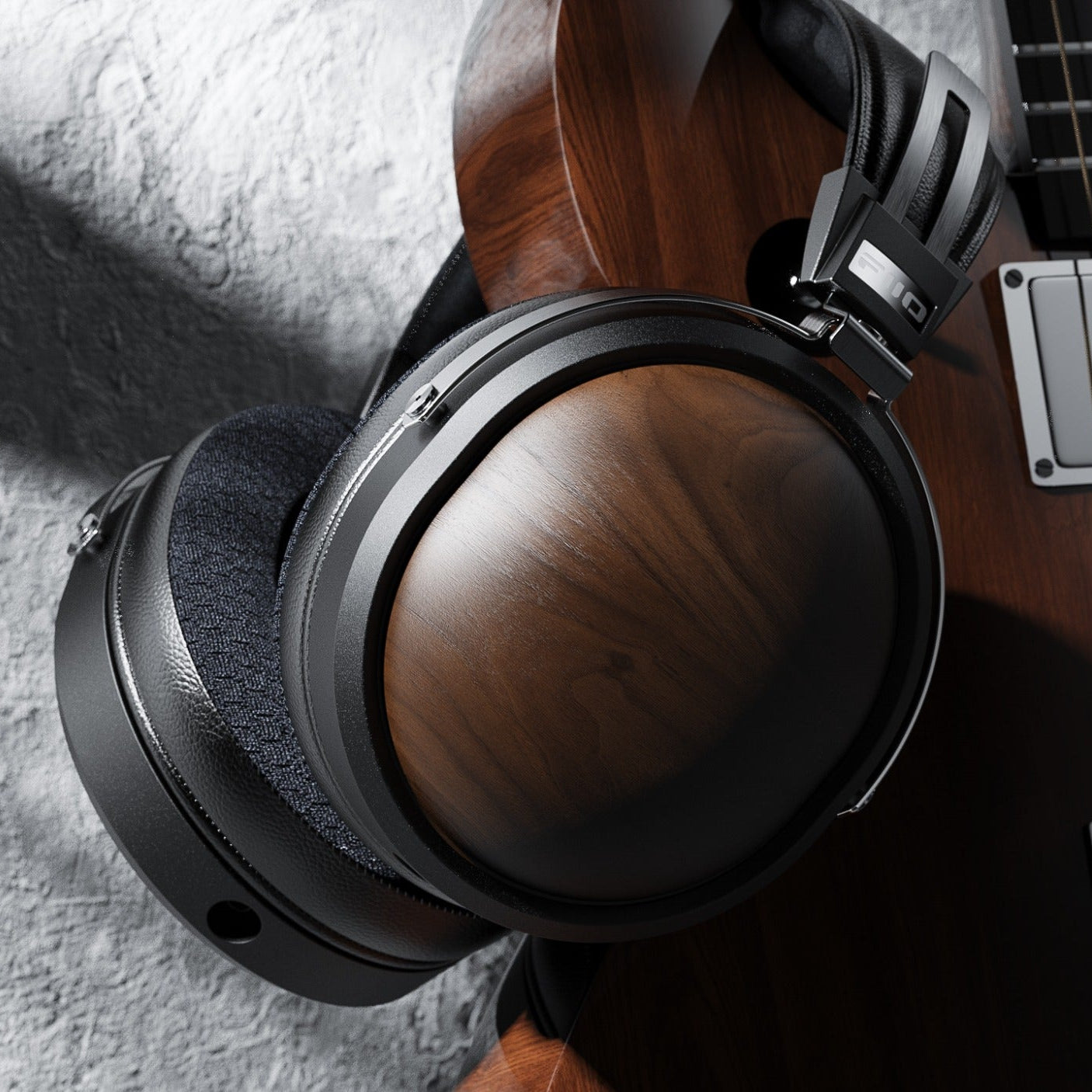FiiO FT1 wired headphones with in-ear design, black finish, and inline remote for music control.