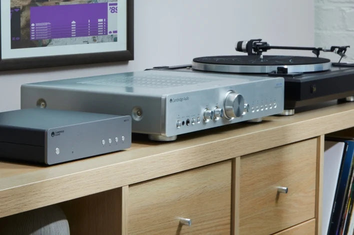 Cambridge Audio MXN10 music streamer with sleek black design, showing front panel with control buttons and display screen.