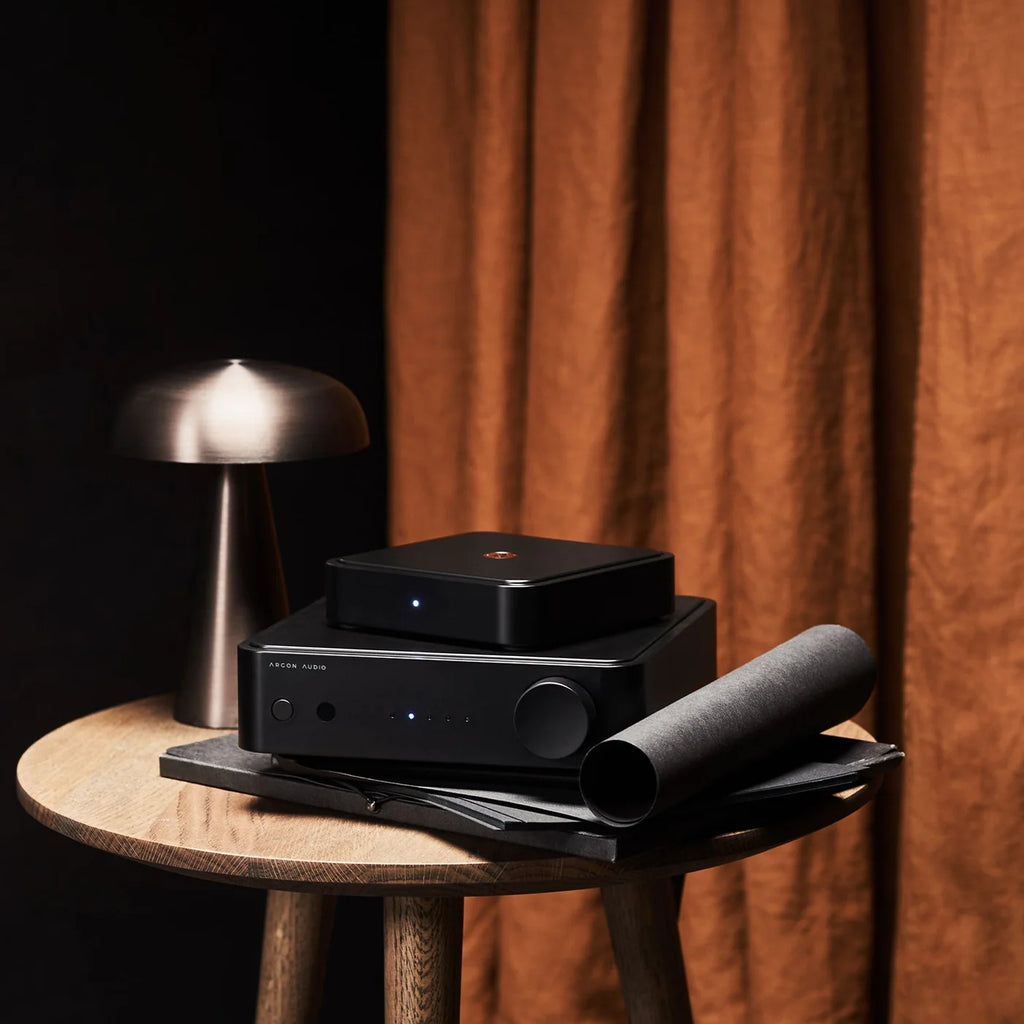 Argon Audio Solo music streamer in black, showing front view with digital display and control buttons.