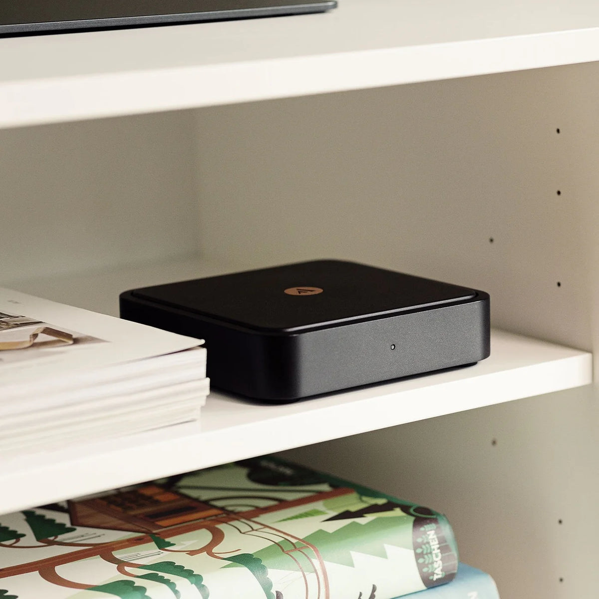 Argon Audio Solo music streamer in black, front view showing device with control buttons and sleek design.