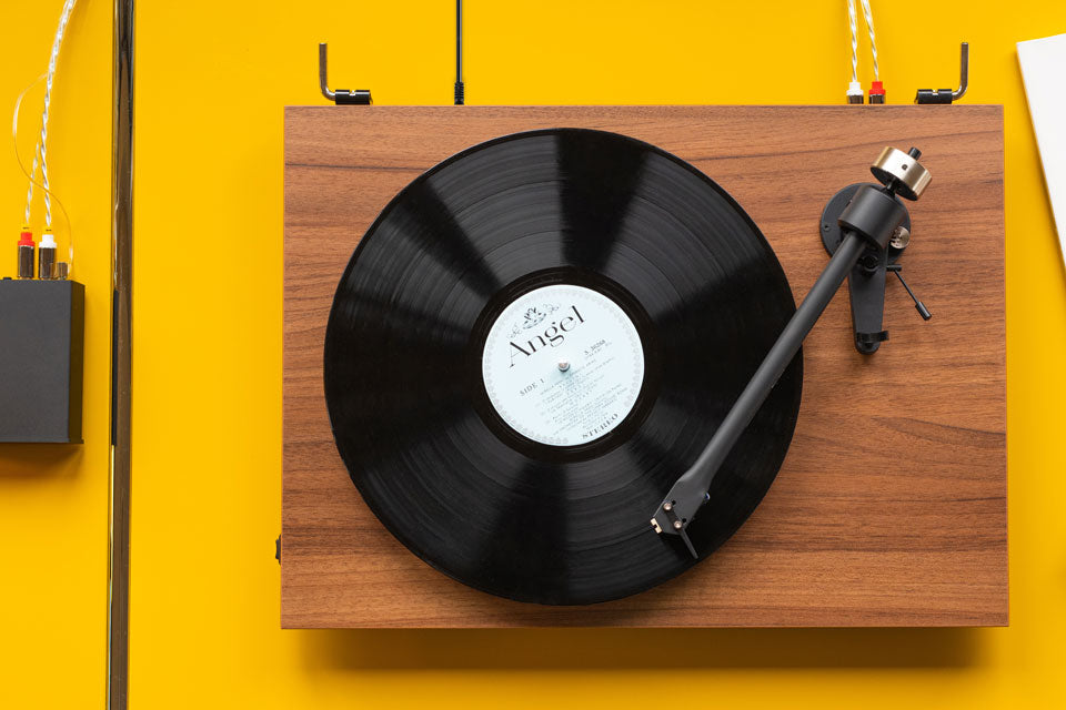 Pro-Ject T2 Super Phono turntable with sleek black finish and tonearm, showcasing high-quality audio design and craftsmanship.