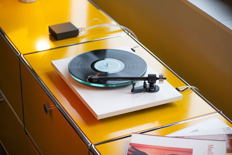 Pro-Ject T2 Super Phono turntable with sleek black finish and modern design, featuring tonearm and platter visible in the image.