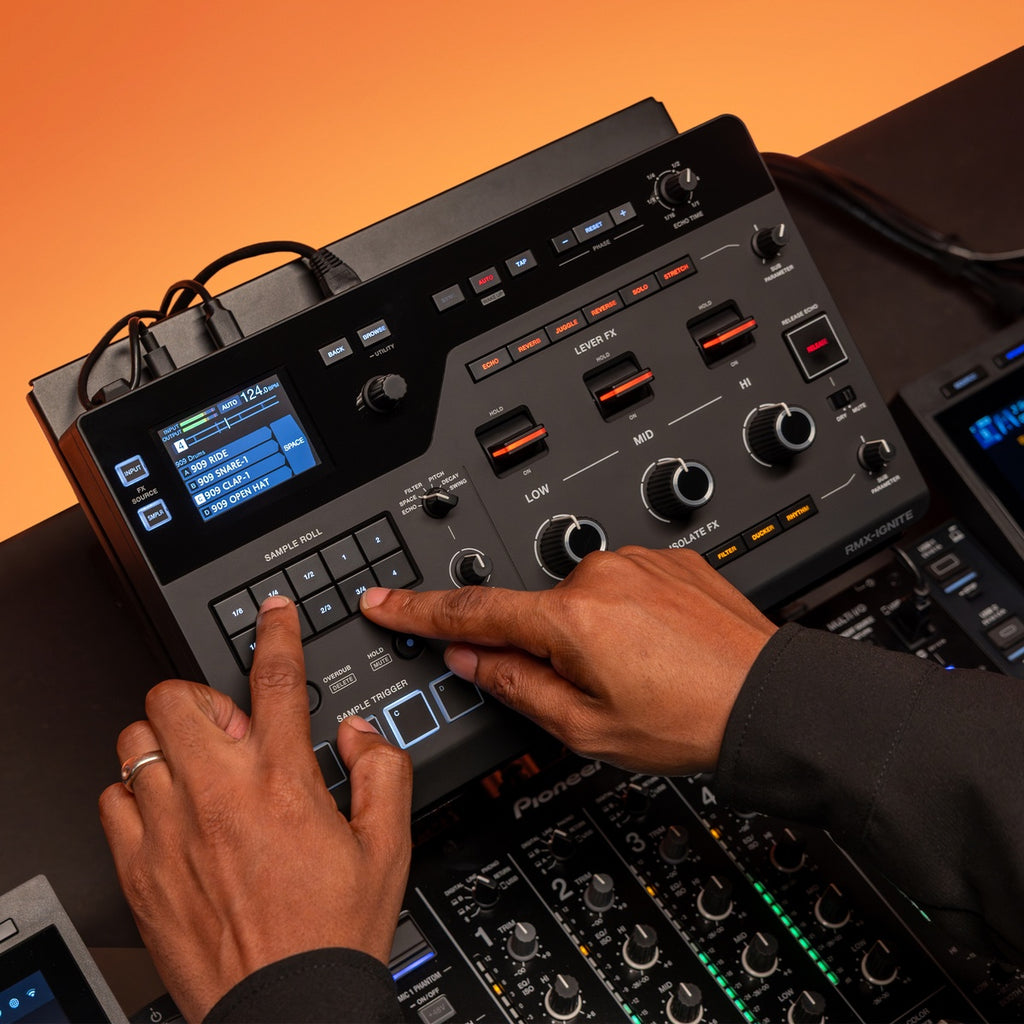AlphaTheta RMX-IGNITE DJ effects unit with colorful controls and display, used for live music mixing and sound enhancement.