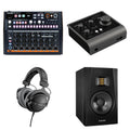 Arturia DrumBrute Impact studio bundle with keyboard and drum machine components, featuring various control knobs and connections.