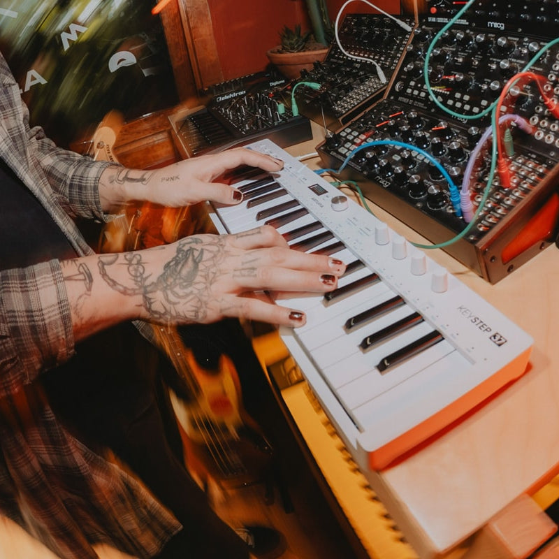 Arturia KeyStep 37 MK2 MIDI controller with sequencer, featuring a compact keyboard, knobs, and control buttons for music production.