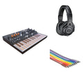 Arturia MicroFreak Starter Kit with compact keyboard, included accessories, and user manual for beginner electronic music production.