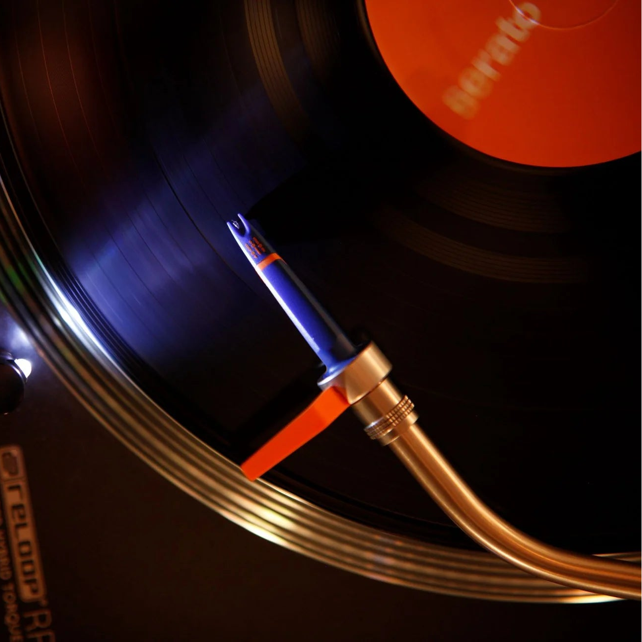 Ortofon Concorde DJ MK2 turntable cartridge with stylus, shown from a top view on a turntable cartridge holder.