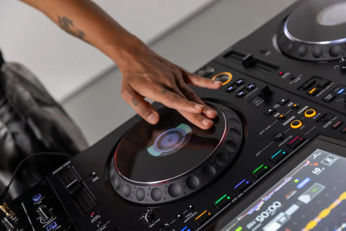 AlphaTheta CDJ-3000X DJ media player with professional controls and large display, shown in a lifestyle setting.