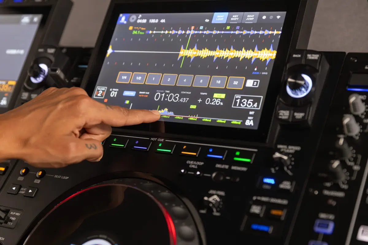 AlphaTheta CDJ-3000X DJ media players with professional controls and colorful interface, shown in a lively DJ setup environment.