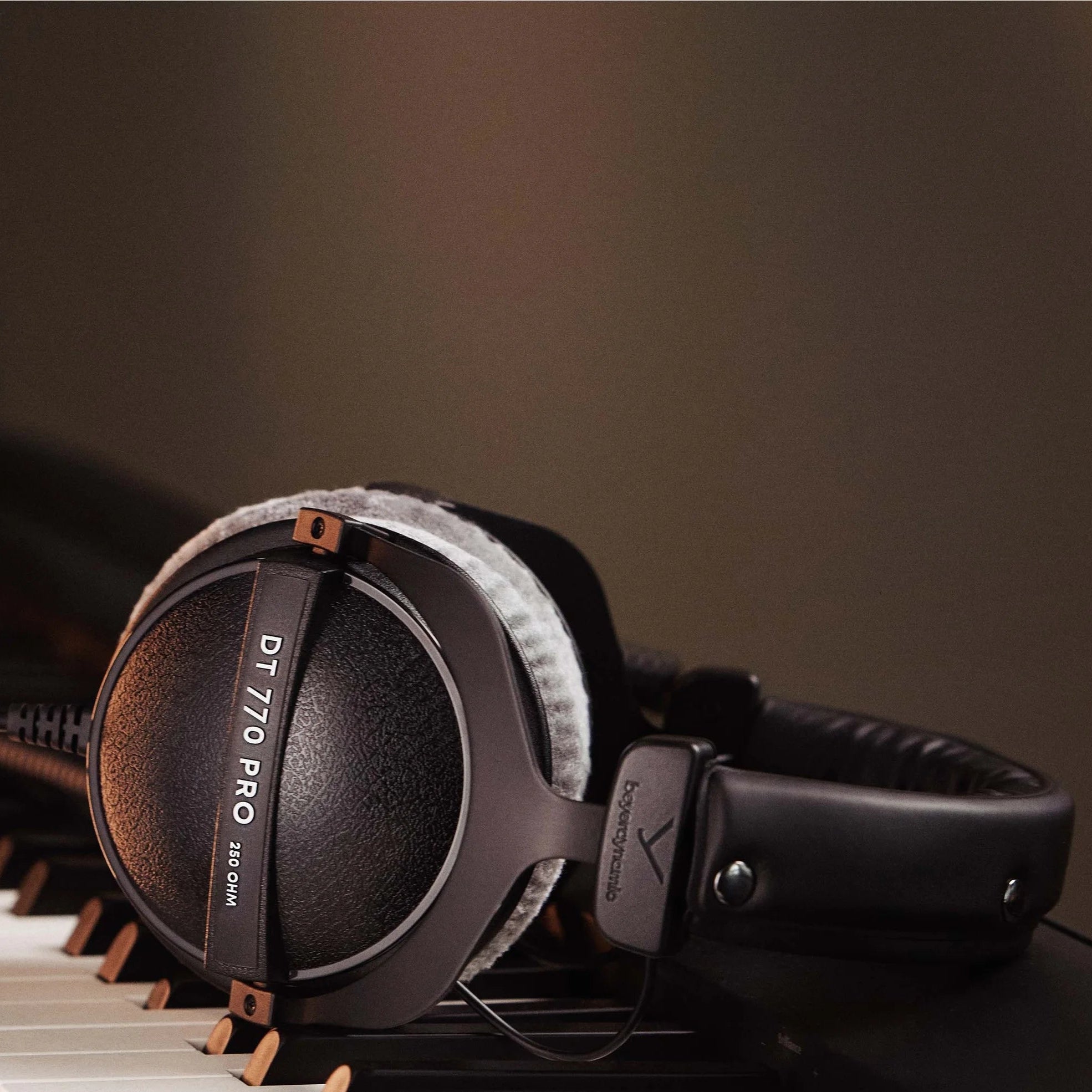 Beyerdynamic DT 770 Pro studio headphones with 250 ohm impedance, made in Germany, featuring over-ear design and padded ear cups.