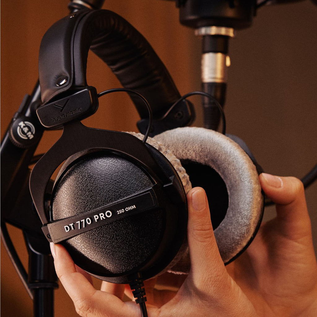 Beyerdynamic DT 770 Pro studio headphones with velour ear cushions and 250 ohm impedance, black and silver design.