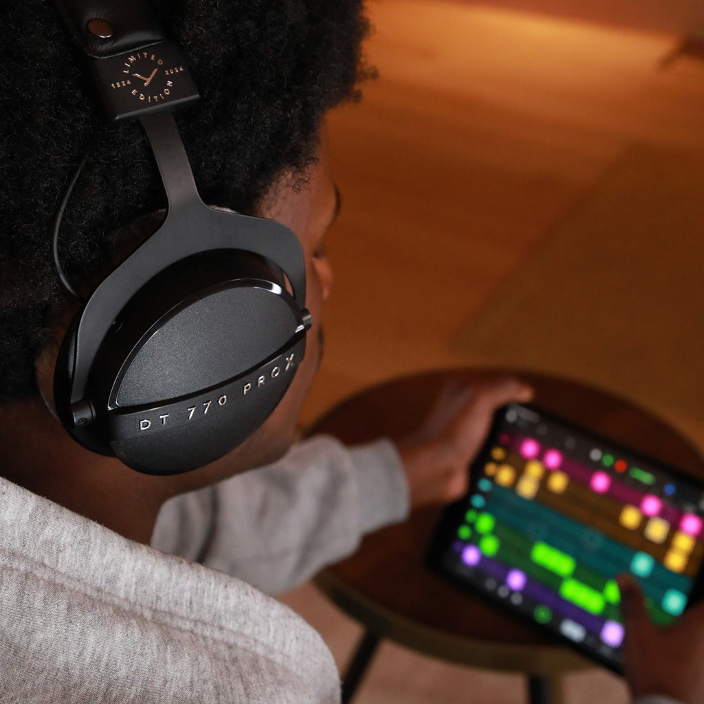 Beyerdynamic DT 770 Pro X studio headphones with over-ear design and black finish, showing ear cups and headband.
