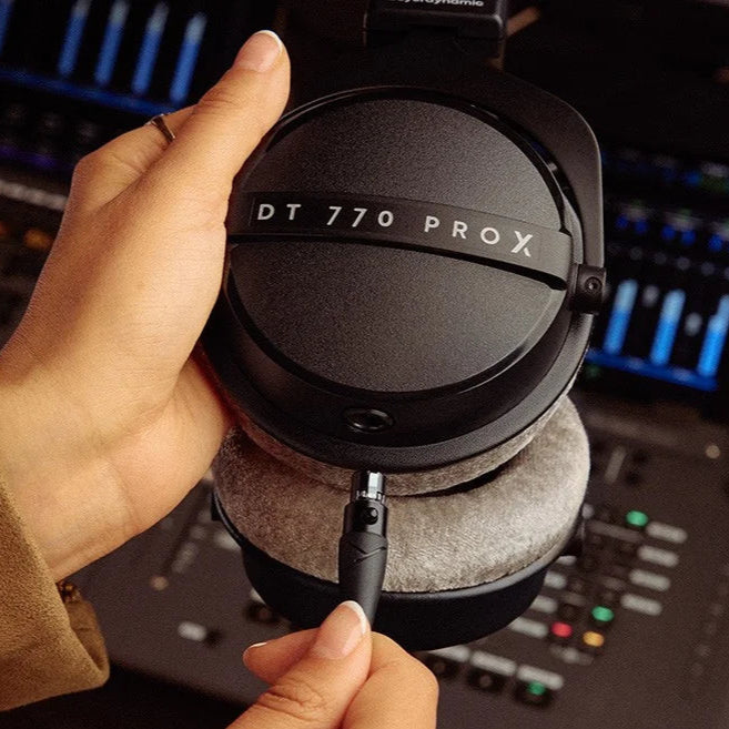 Beyerdynamic DT 770 Pro X studio headphones with detachable cable, black over-ear design, and padded ear cups for comfort.