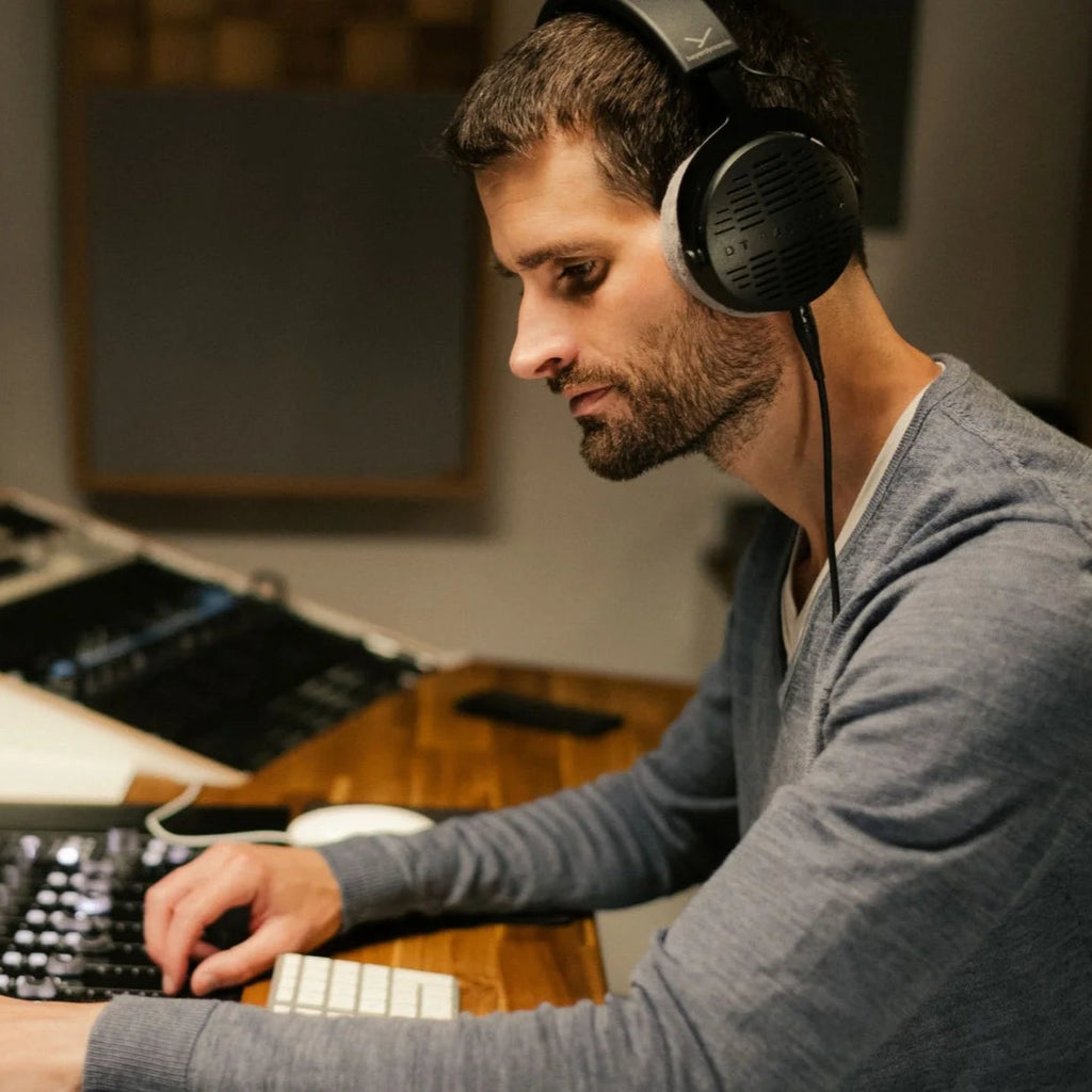 Beyerdynamic DT 900 Pro X studio headphones with over-ear design, black ear cups, and adjustable headband for professional audio.