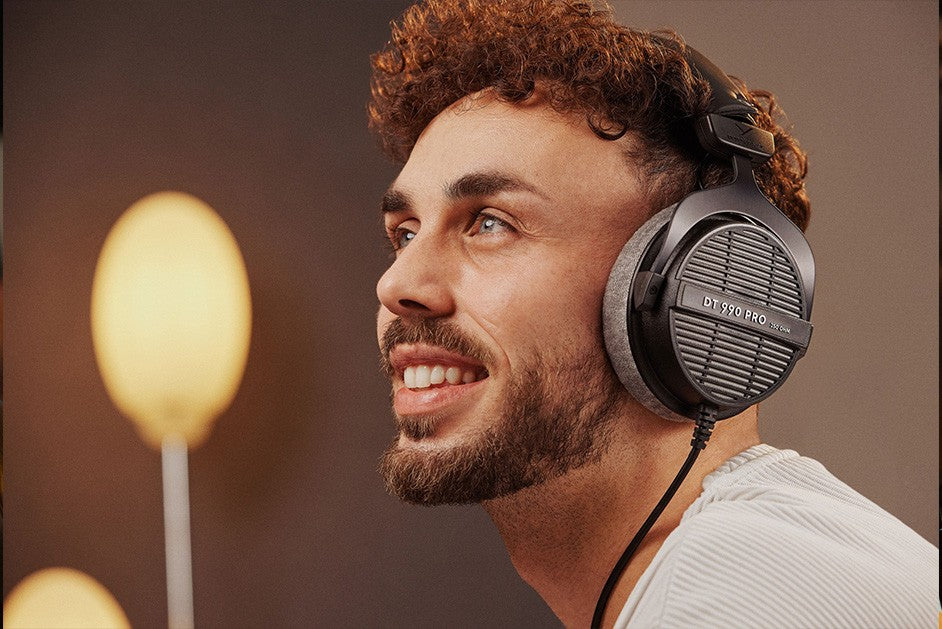Beyerdynamic DT 990 Pro studio headphones with 250 ohm impedance, black design, featuring plush ear cushions and adjustable headband