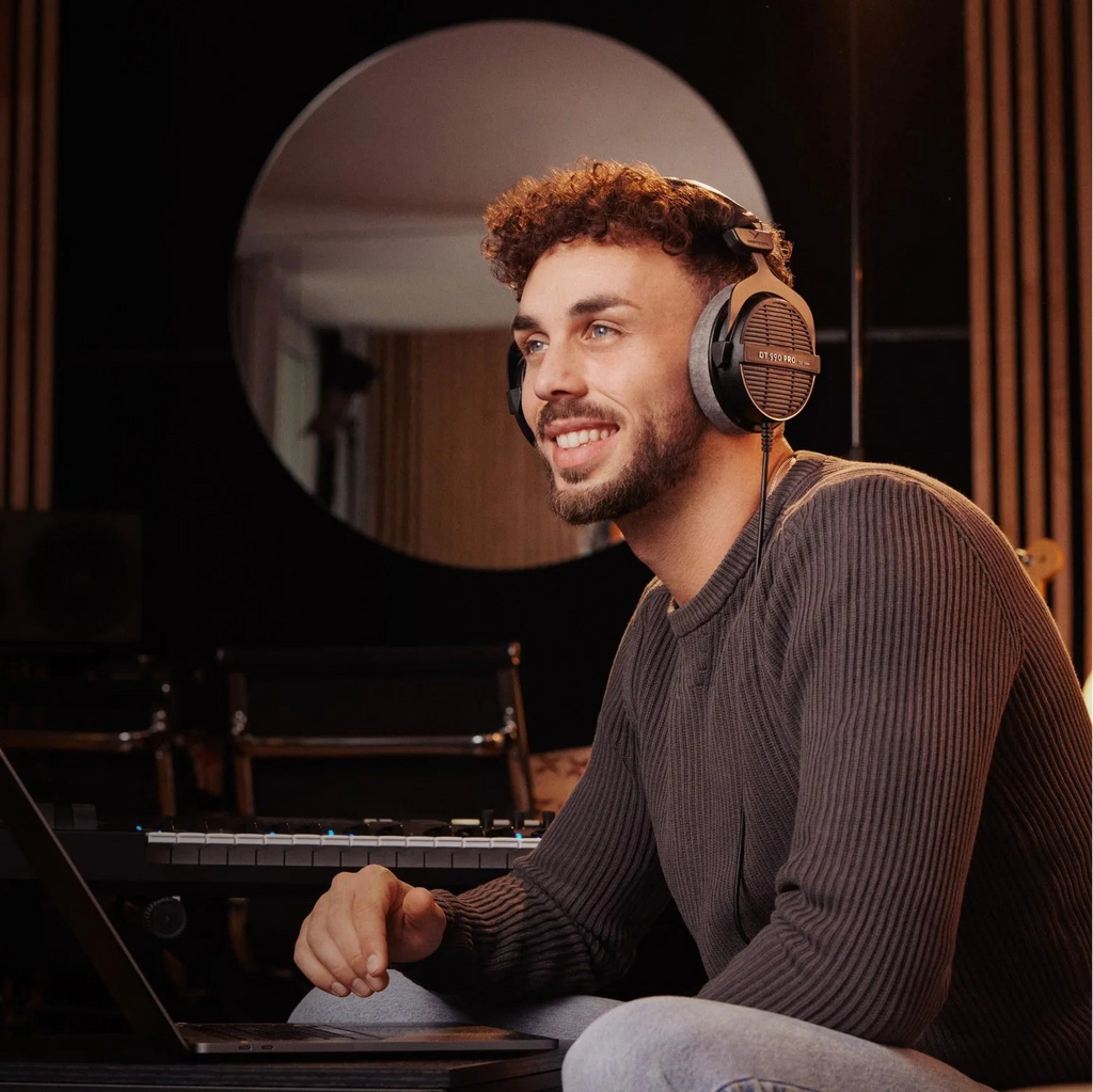 Beyerdynamic DT 990 Pro studio headphones with open-back design, 250 ohm impedance, ideal for mixing and mastering.