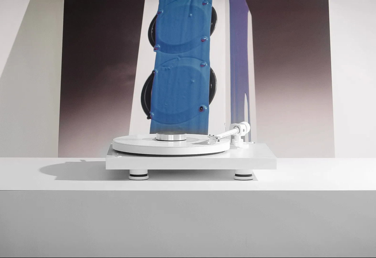 Pro-Ject Debut Pro white edition turntable with sleek design and tonearm, ideal for high-quality vinyl listening.
