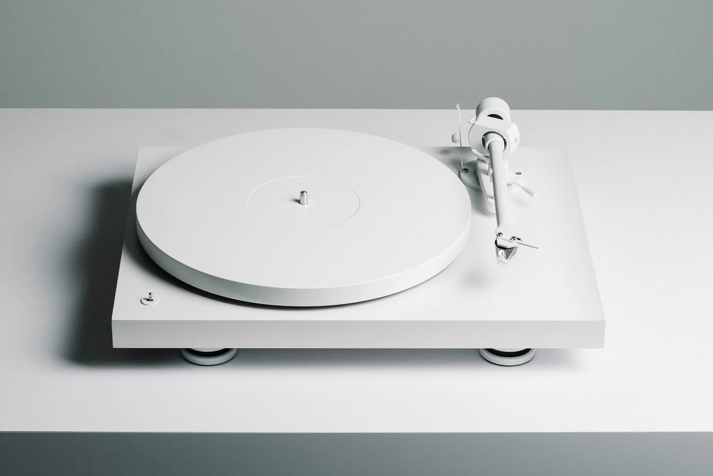 Pro-Ject Debut Pro white edition turntable with sleek design and tonearm, featuring high-quality audio components.