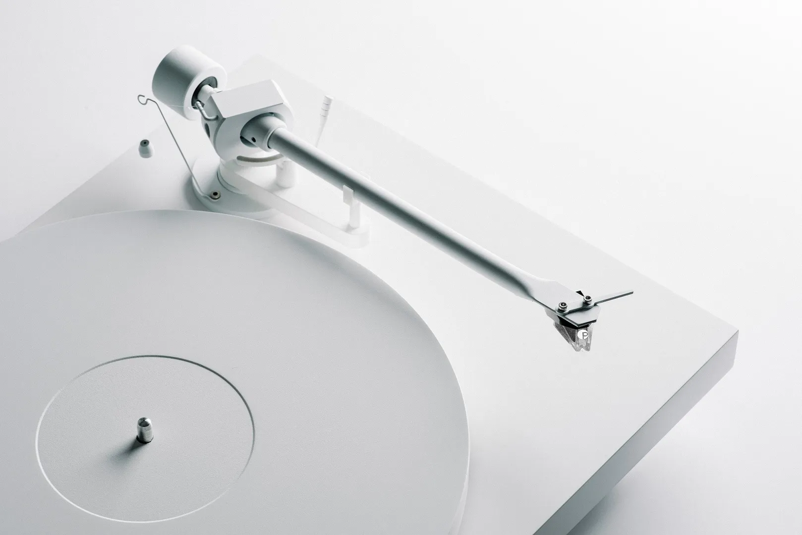 Pro-Ject Debut Pro white edition turntable with sleek design, tonearm, and platter, showcasing high-quality audio equipment.