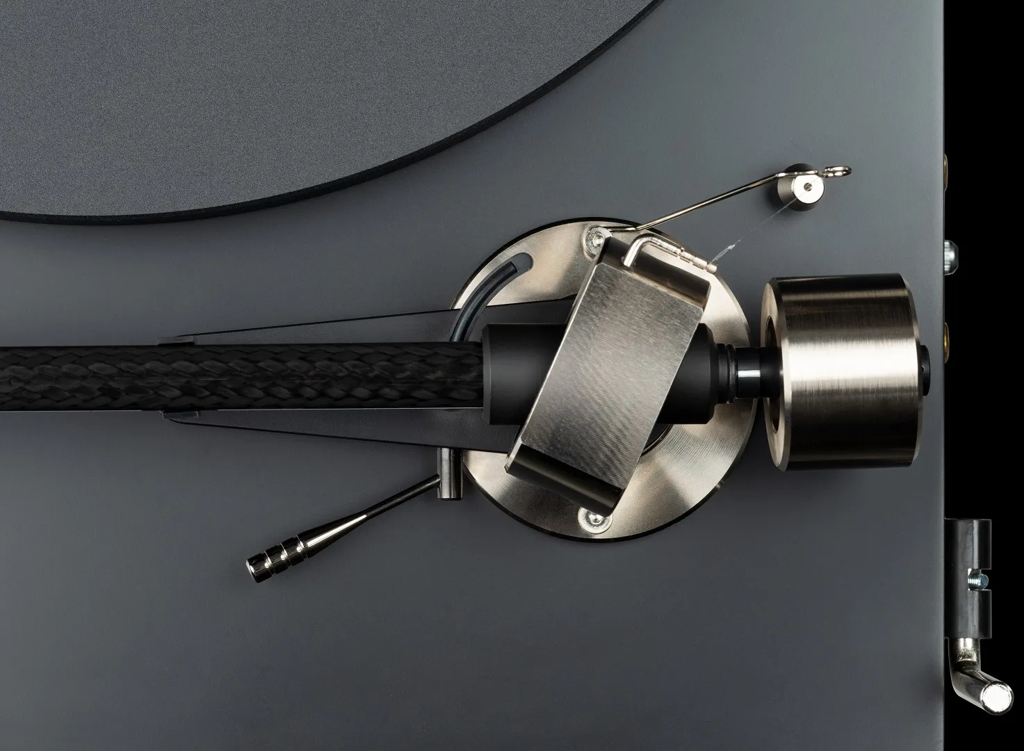 Pro-Ject Debut Pro turntable with sleek design, wooden plinth, and tonearm, set on a modern listening setup in a lifestyle image.
