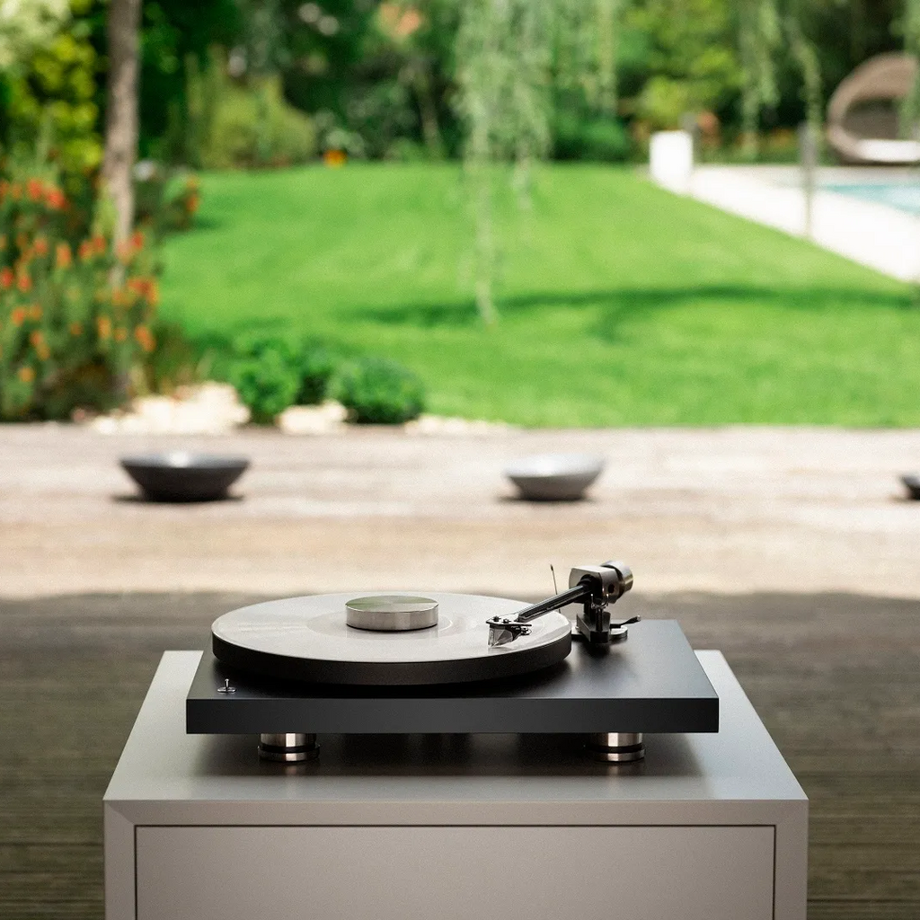 Pro-Ject Debut Pro turntable with sleek design, featuring tonearm and platter, ideal for high-quality vinyl listening.