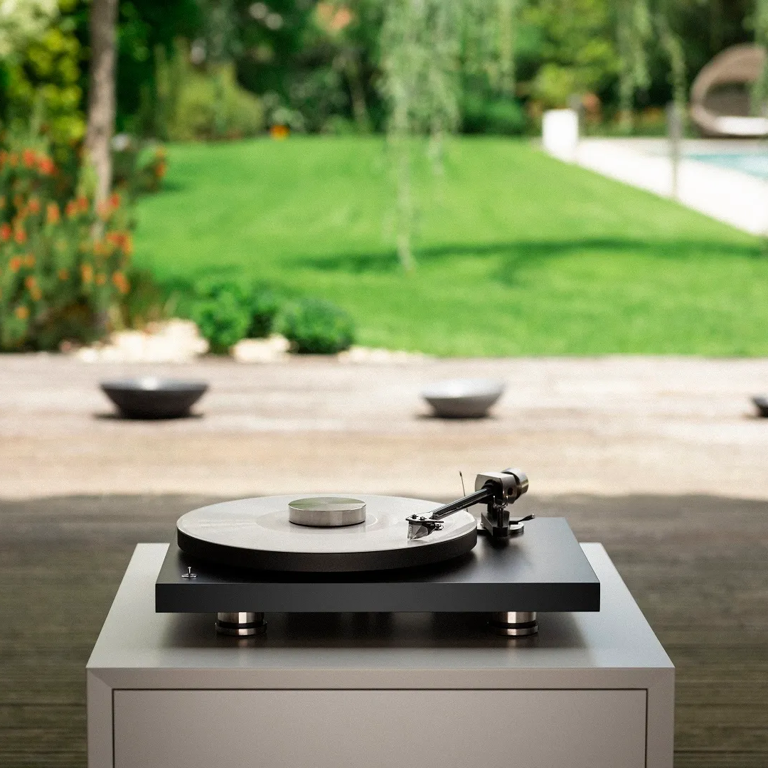 Pro-Ject Debut Pro turntable with sleek design, featuring tonearm and platter, ideal for high-quality vinyl listening.
