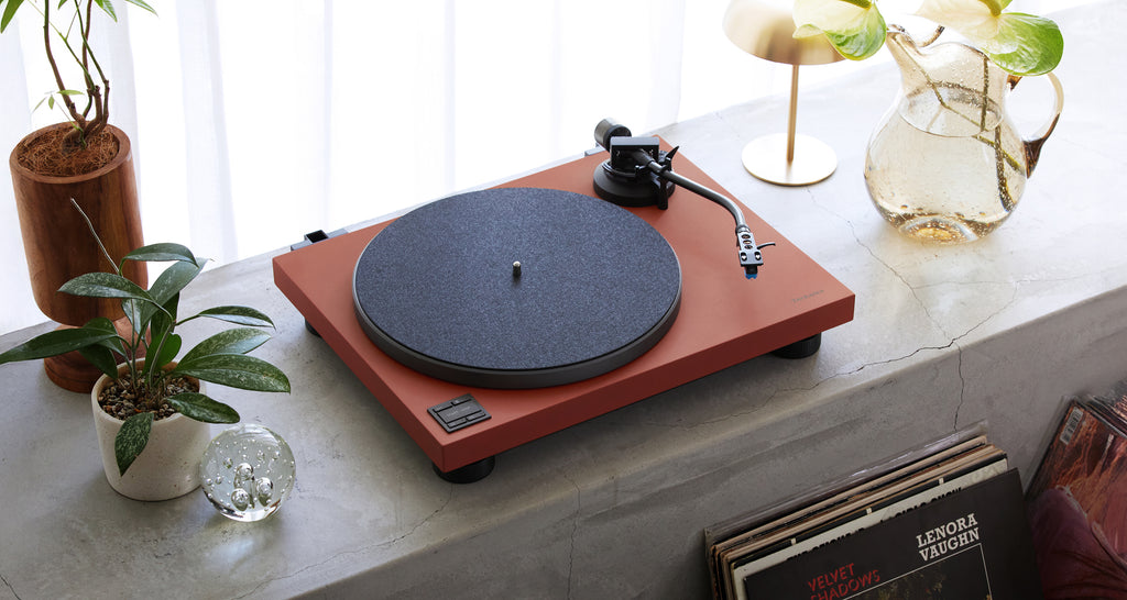Technics SL-40CBT turntable with a sleek design, featuring a tonearm and record platter for high-quality vinyl playback.