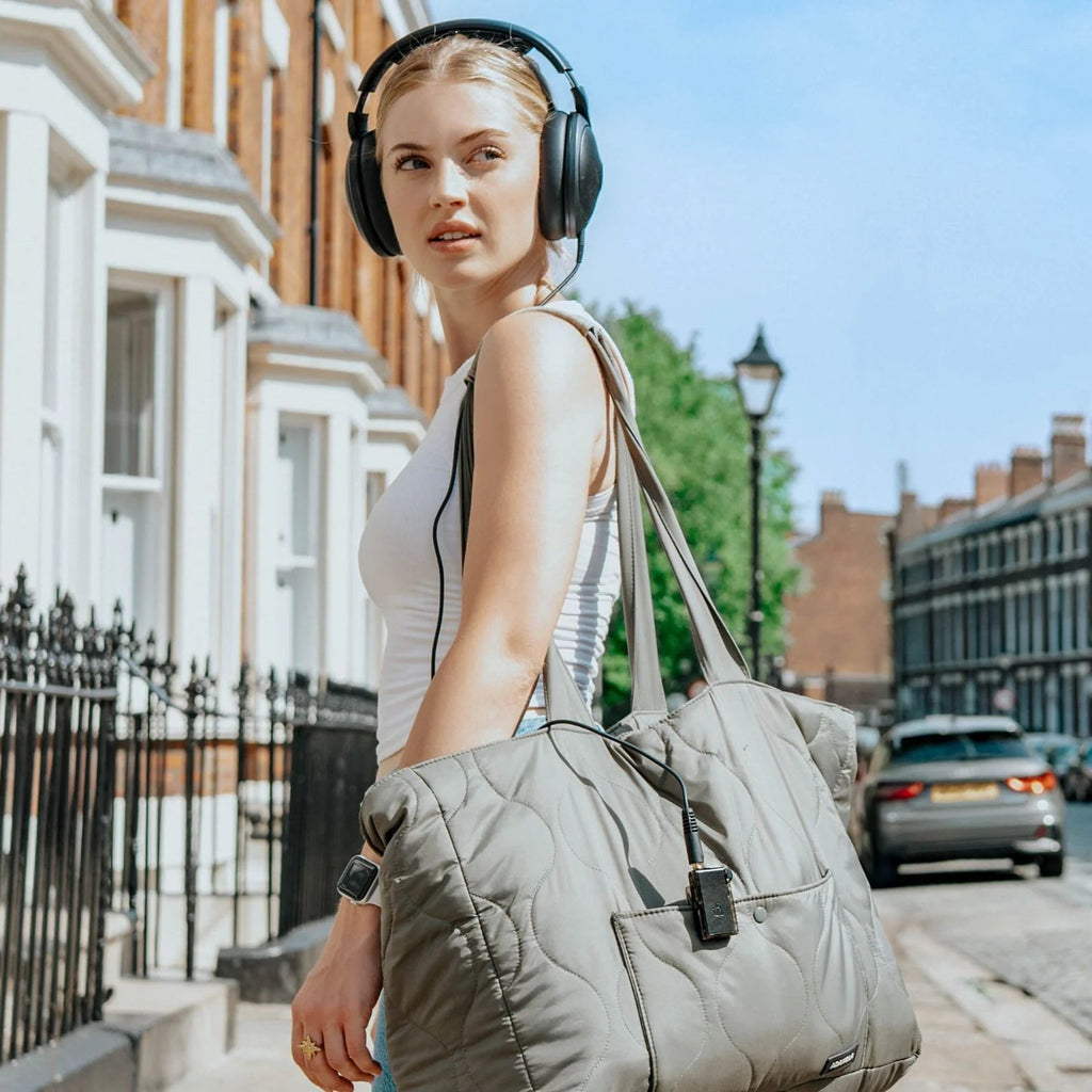 iFi Audio Go Blu Air headphone amplifier and DAC, compact black device with controls and ports, designed for high-quality audio.
