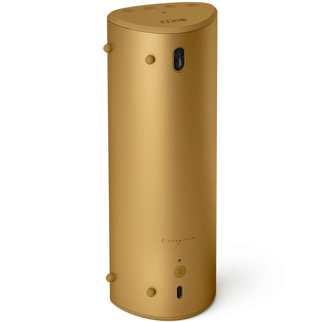 KEF Muo portable speaker in Amber Haze color with sleek design, showing the front grille and compact shape.