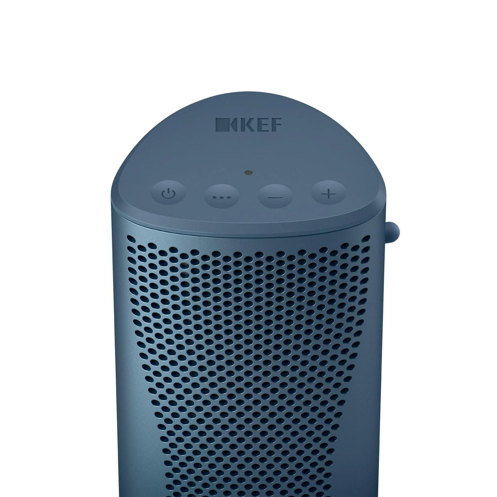 Blue KEF Muo portable speaker with touch controls on top, showcasing its sleek design and compact size.