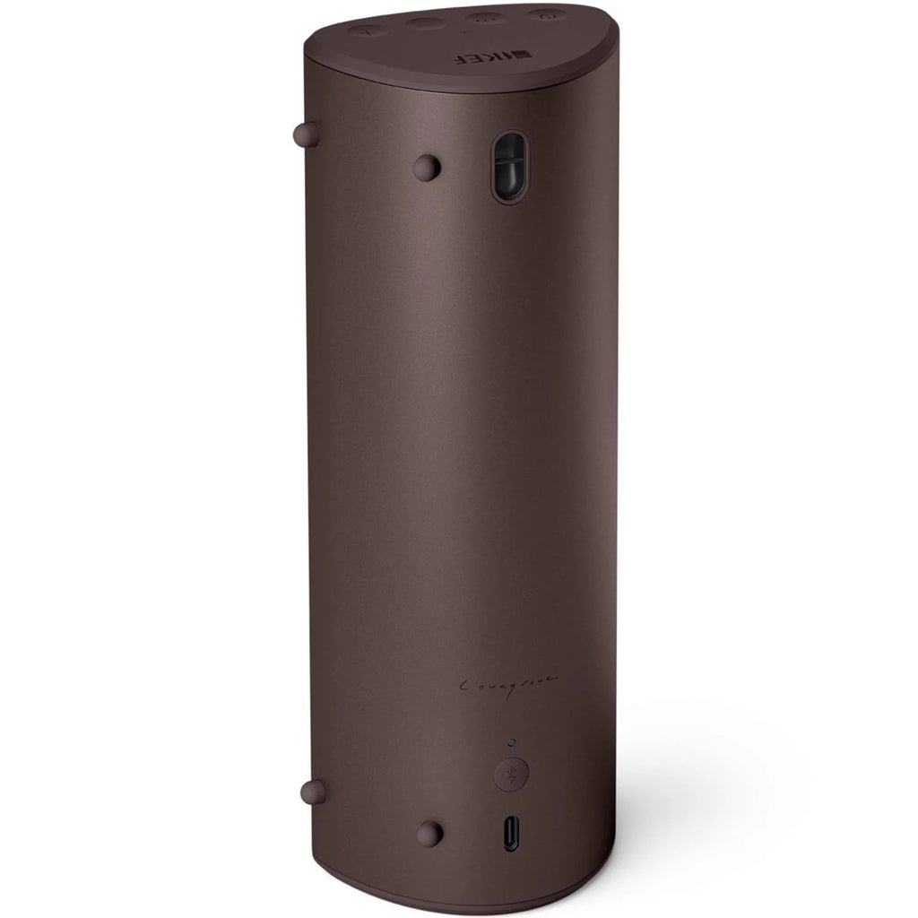 KEF Muo portable speaker in cocoa brown color, showing the back view with fabric grille and control buttons.