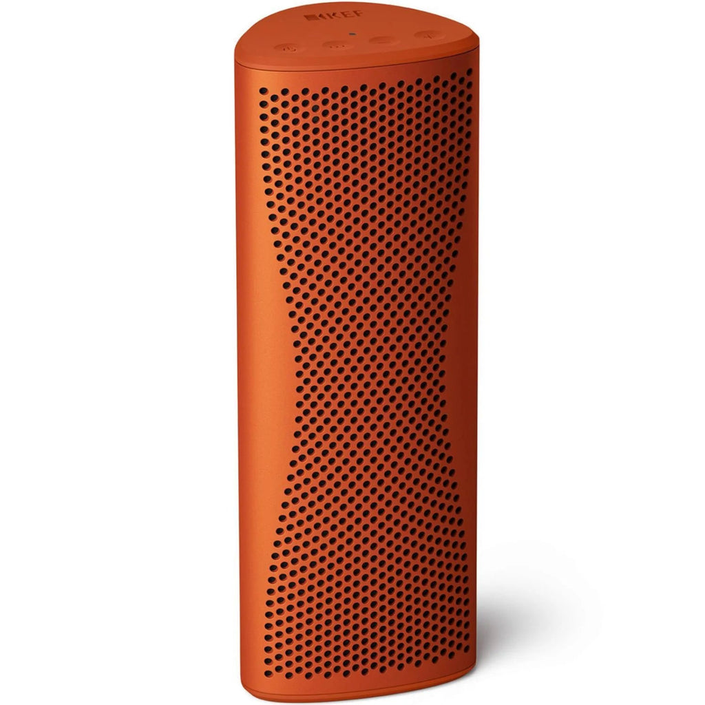 KEF Muo portable speaker in orange, showing the front and top view with a sleek, modern design and textured surface.
