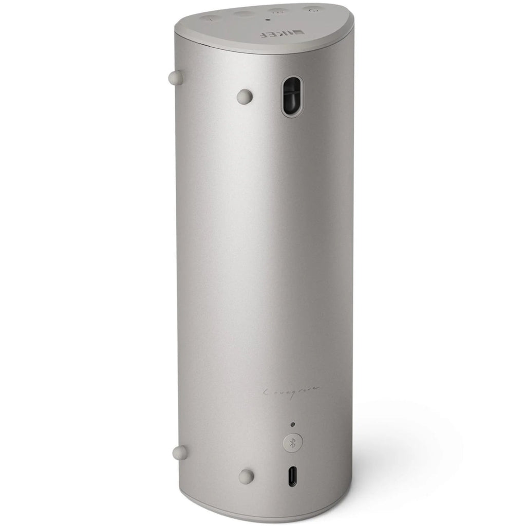 KEF Muo portable speaker in silver dusk color, showing the back view with textured surface and compact design.